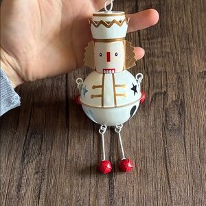 Ashland White and Gold Nutcracker Bell Ornament with Red Accents